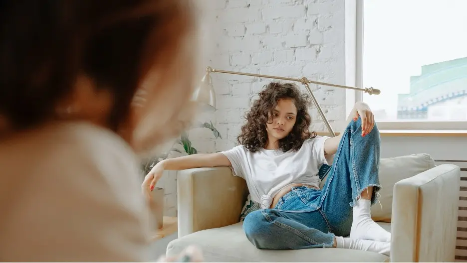Young person sitting on a chair