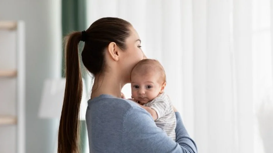 Mother holding her baby
