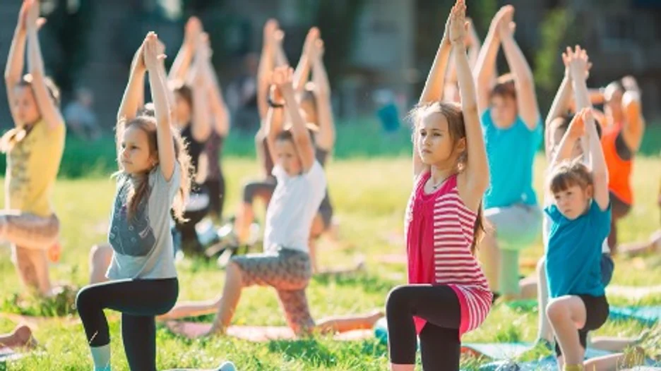 A group of kids doing yoga
