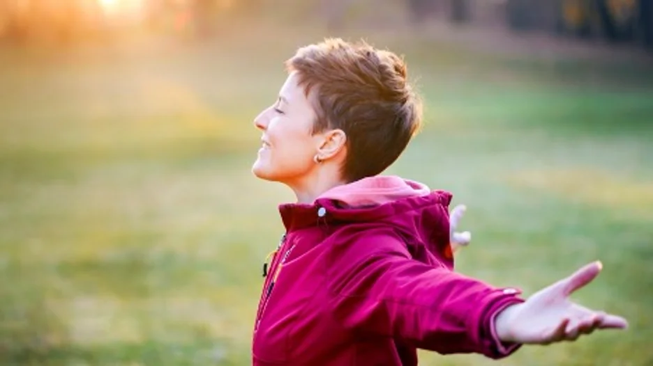 A person with her arms out