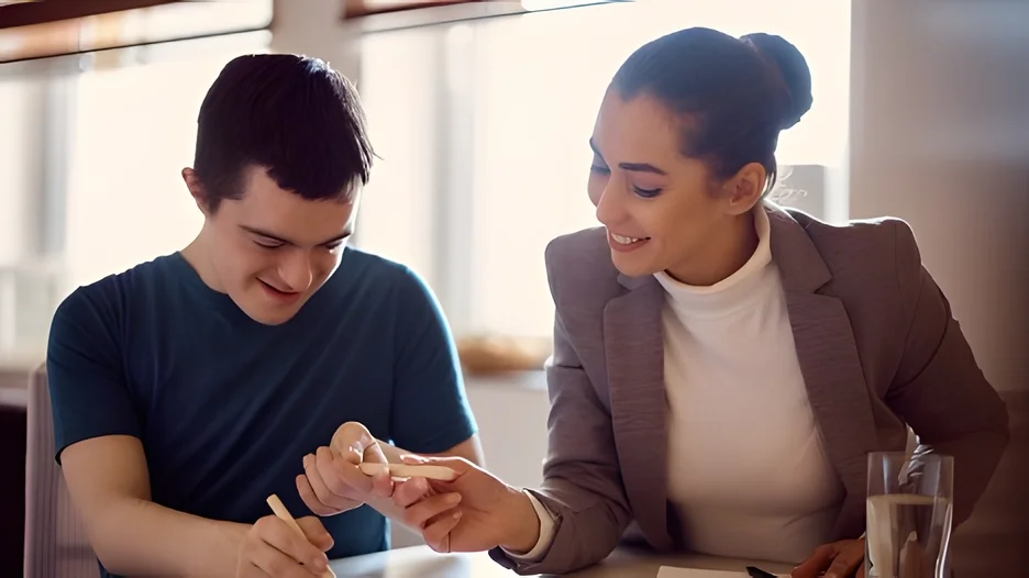An older woman helping a older boy with homework lesson