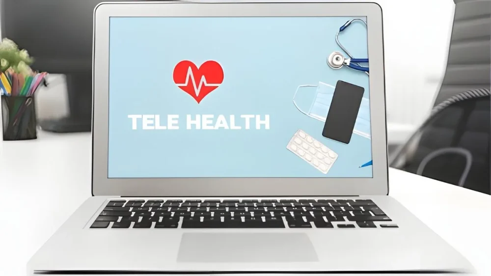Laptop computer with screen showing Tele Health page