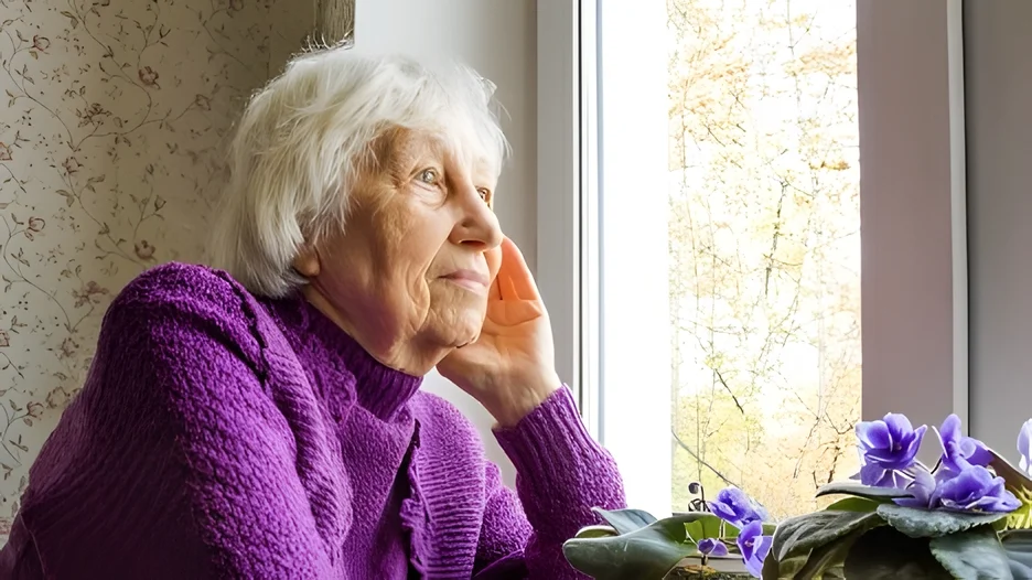 An old person in purple sweater
